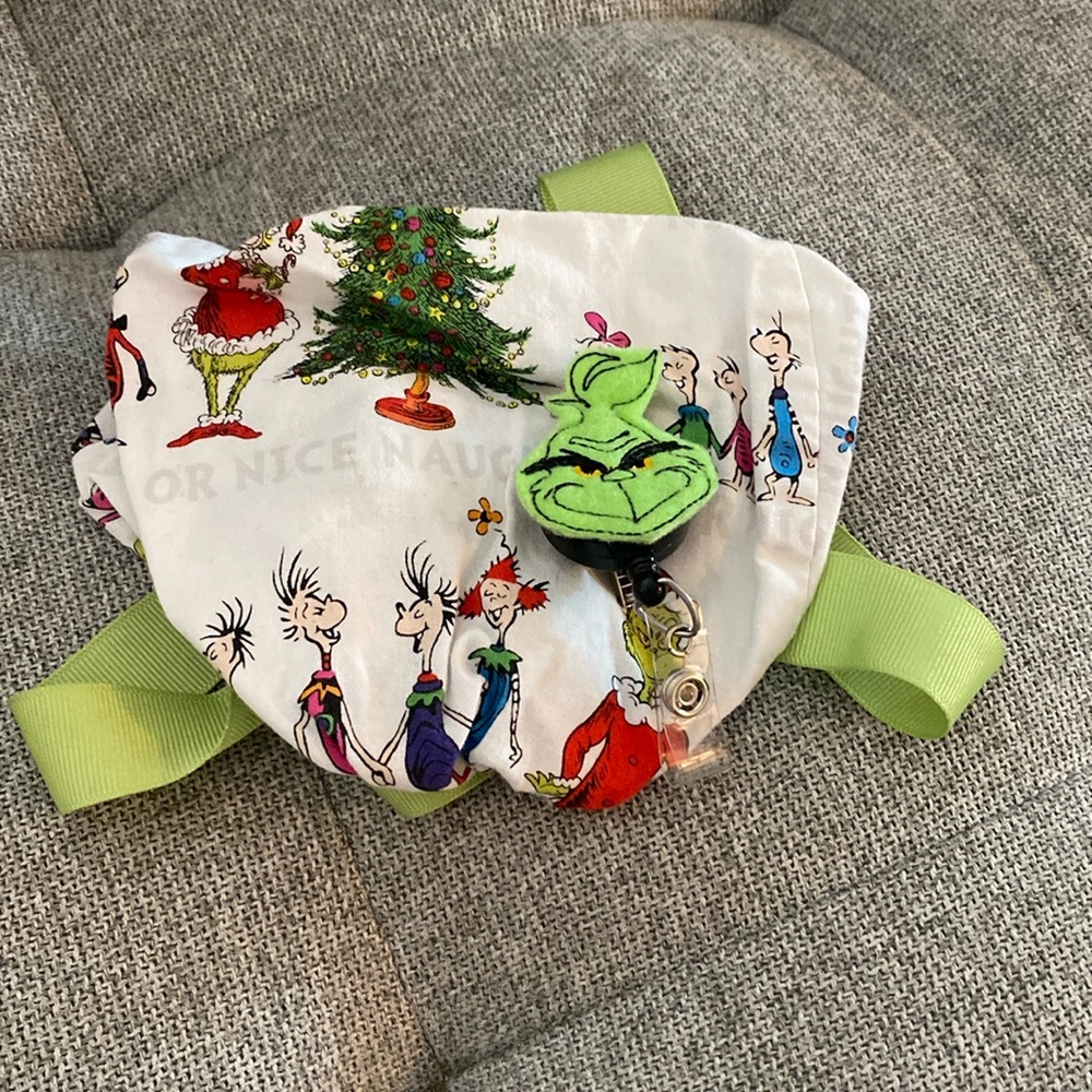 Dr. Seuss’ The Grinch ponytail scrub cap with badge reel